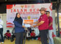 Jalan santai HUT ke-81 RI RW 02 Pekuncen galang Rp898.00 untuk korban bencana NTT.